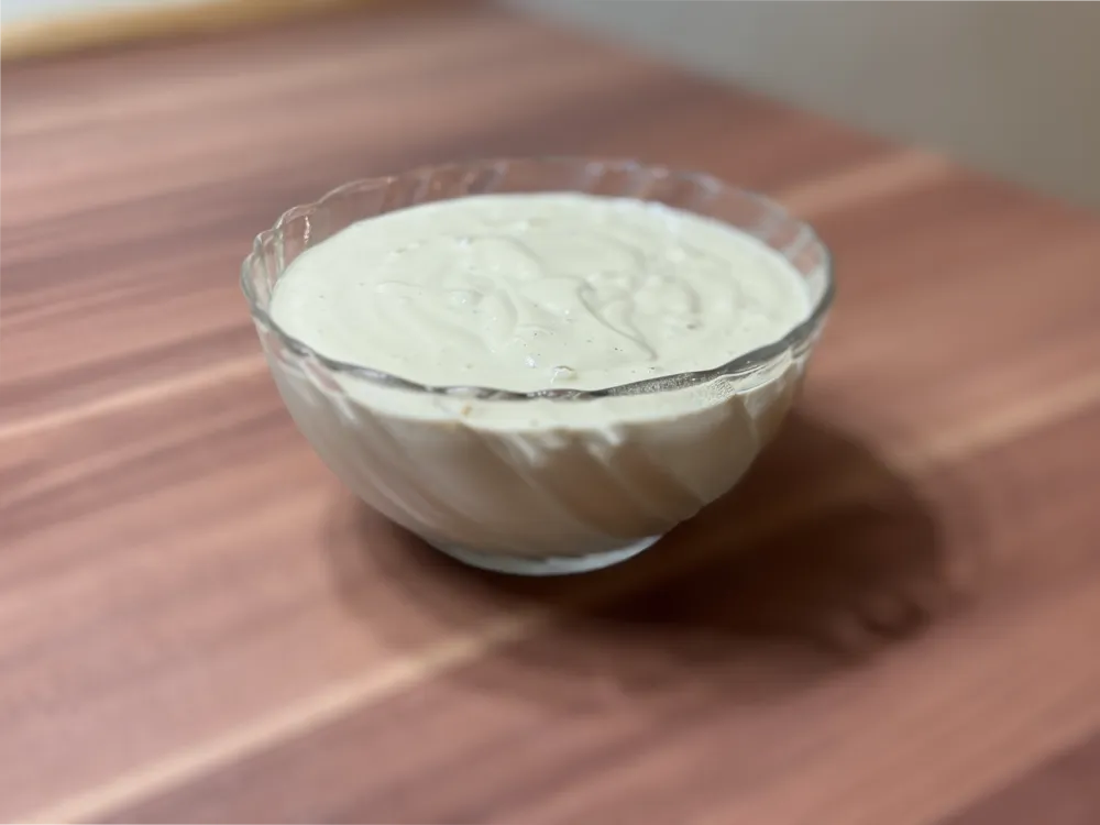 Tahini sauce in a small bowl.