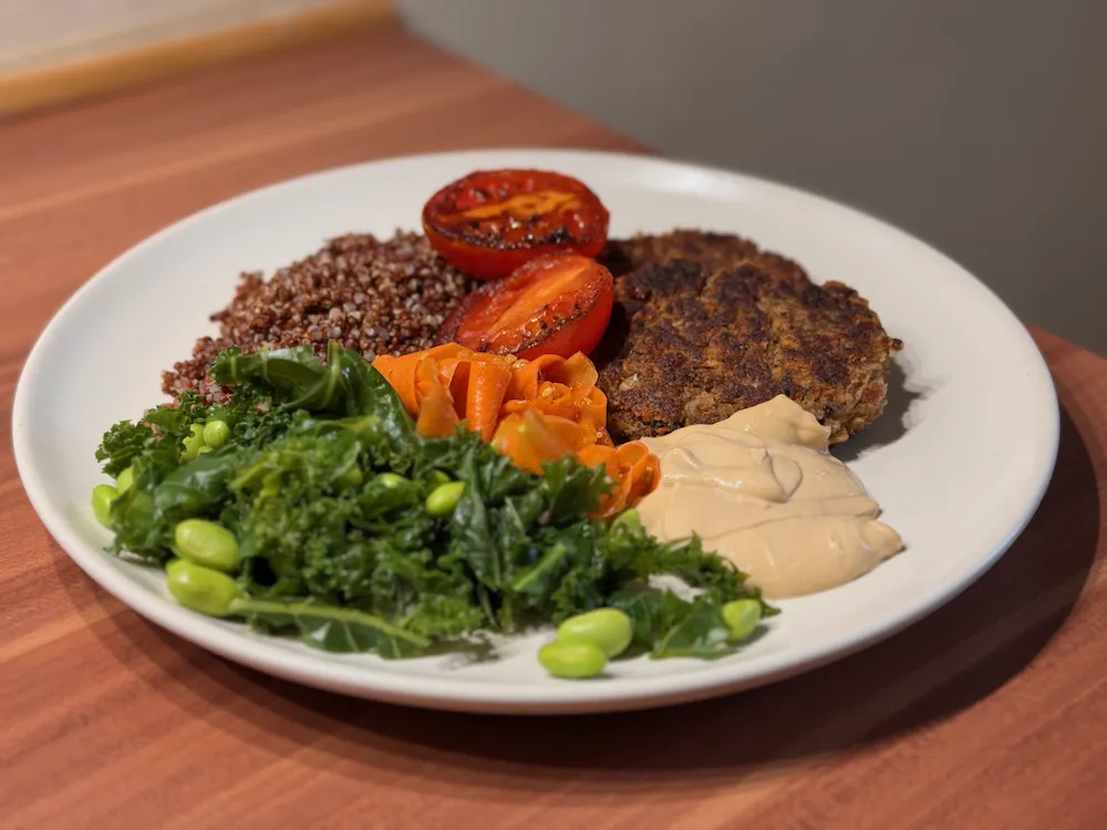 Delicious Bean Patties served with grilled tomatoes and veg.